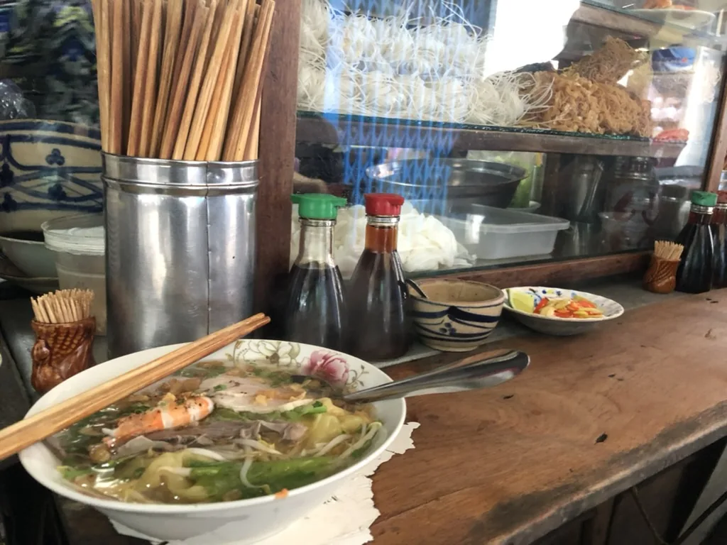 Hủ tiếu mì at a Chợ Lớn counter, where migration and breakfast culture meet.