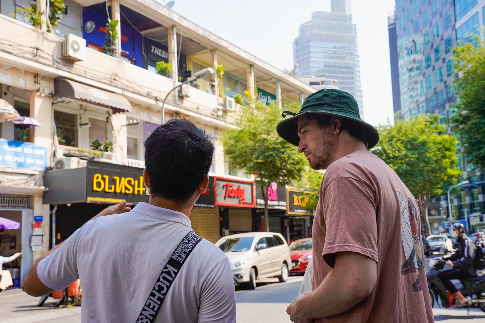 SaigonWalks guide leading a street route