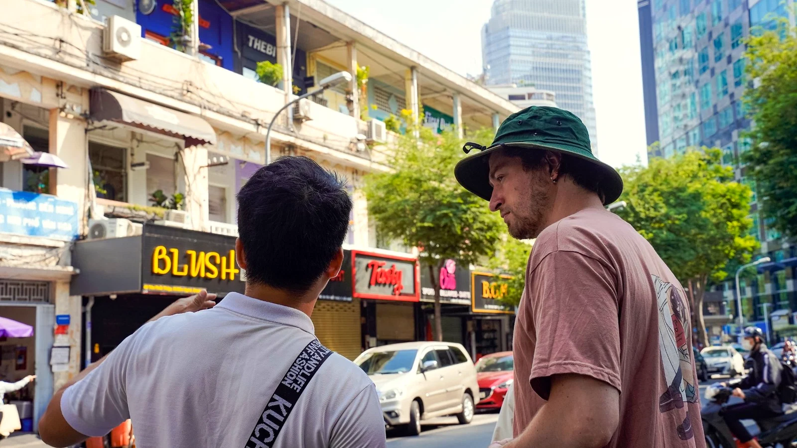 SaigonWalks guide leading a walk through central Saigon